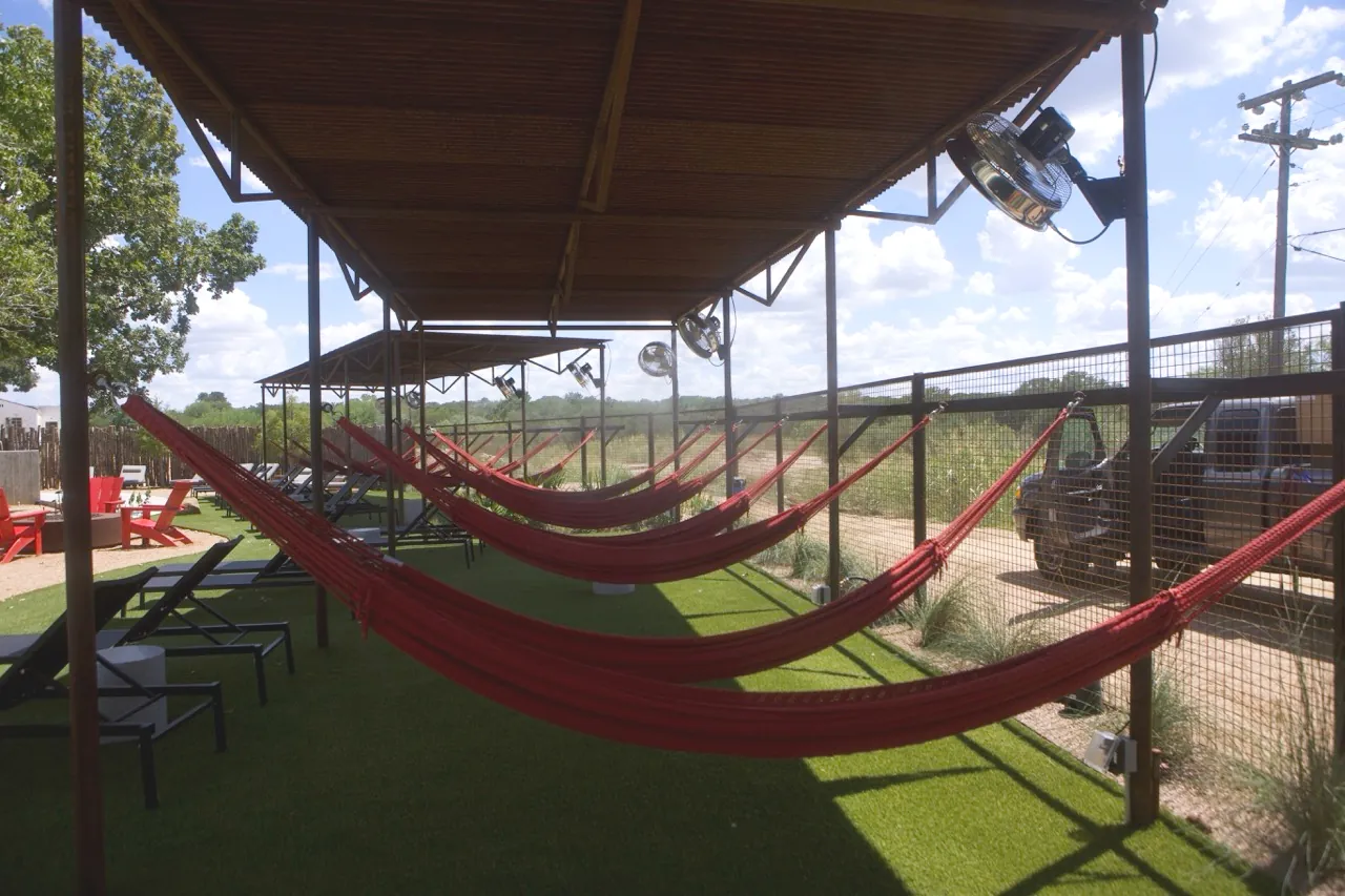 Hammock lounge shade structure with misting fans
