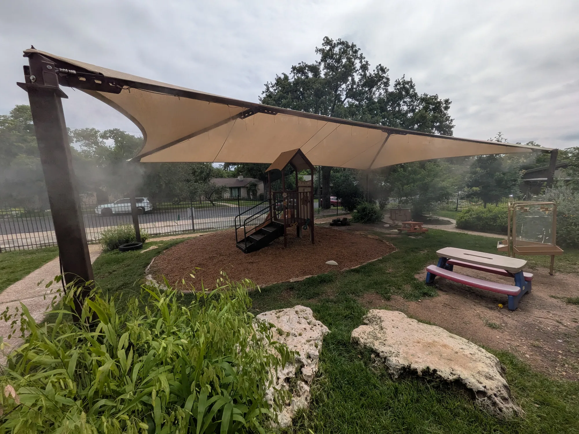 Playground shade structure with misting system