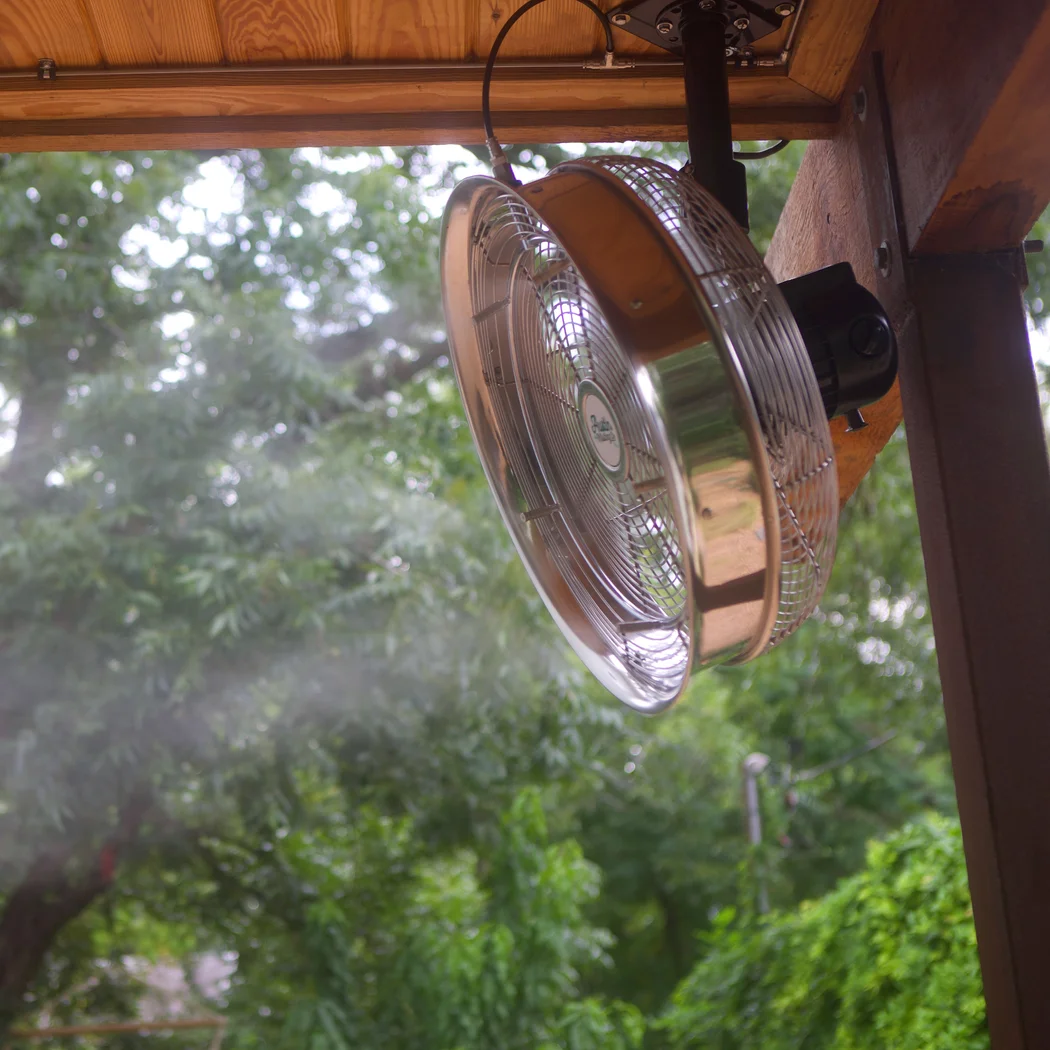 Misting fan blowing cool mist